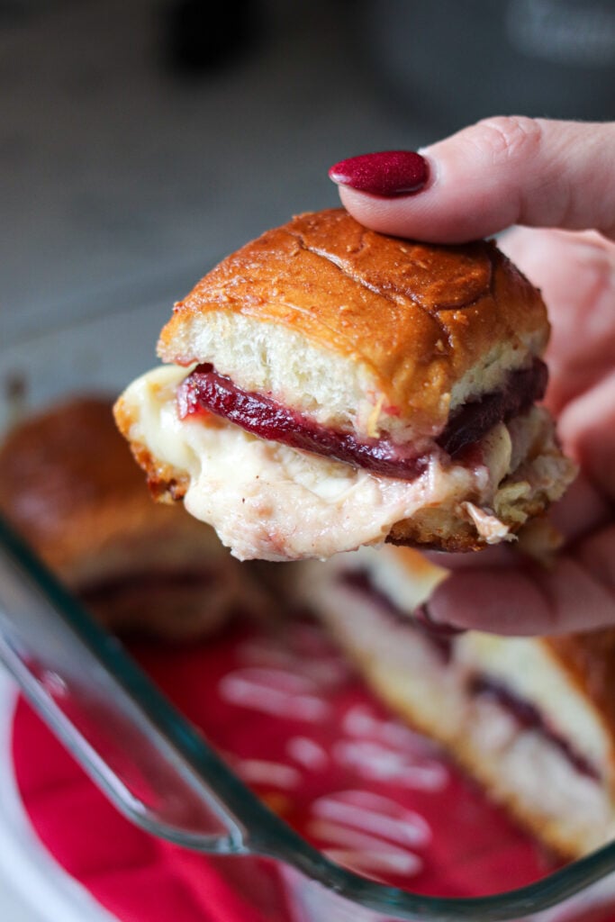 Turkey Cranberry Sliders are the ULTIMATE Thanksgiving leftovers meal! Packed with turkey, cranberry sauce and cheese, these sliders are so good!