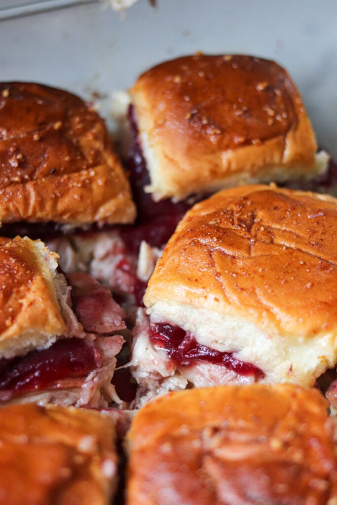Turkey Cranberry Sliders are the ULTIMATE Thanksgiving leftovers meal! Packed with turkey, cranberry sauce and cheese, these sliders are so good!