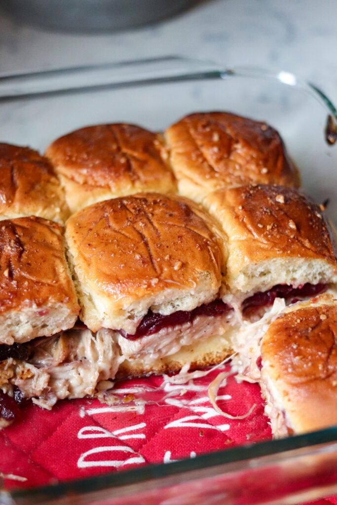 Turkey Cranberry Sliders are the ULTIMATE Thanksgiving leftovers meal! Packed with turkey, cranberry sauce and cheese, these sliders are so good!